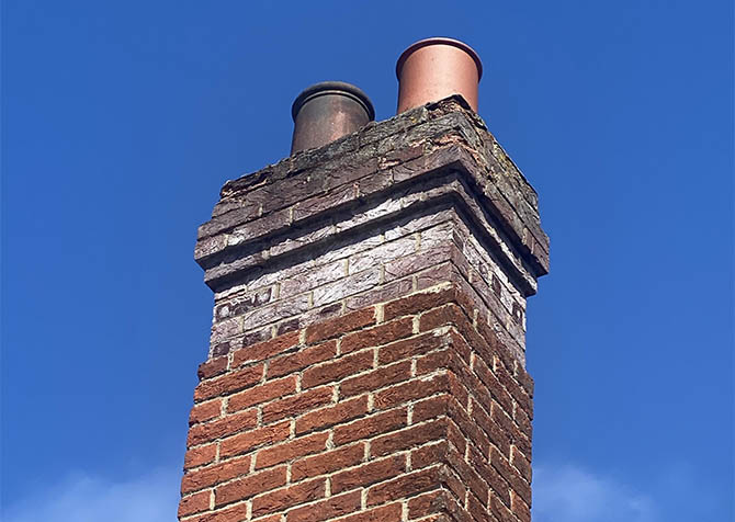 Chimney stack missing pointing and brick spalling