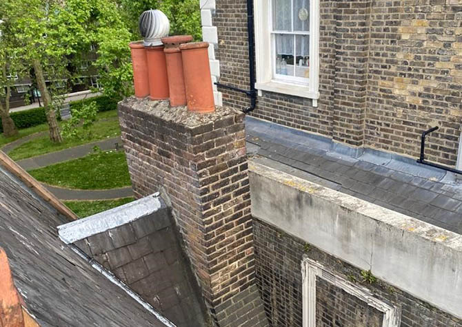 Listed building leaning chimney stack